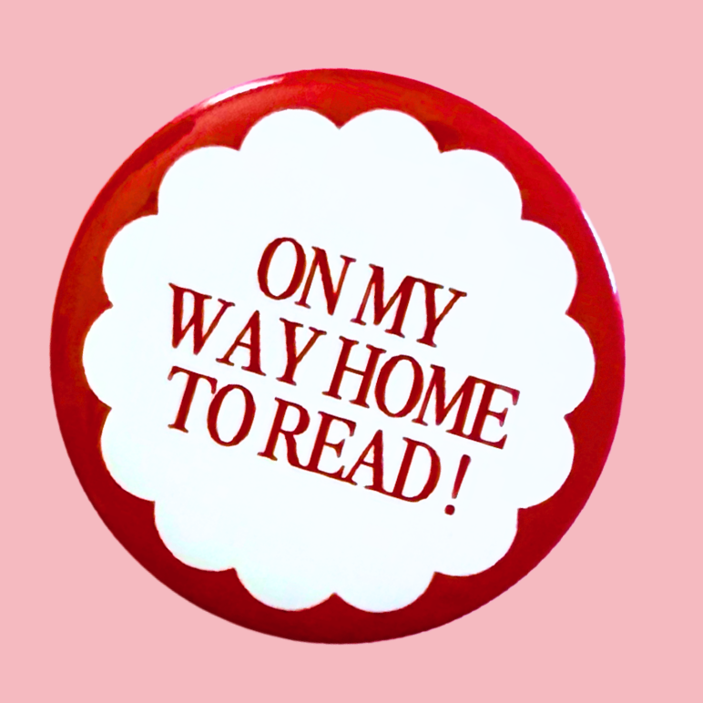 Set of five buttons with various text and designs on a pink background