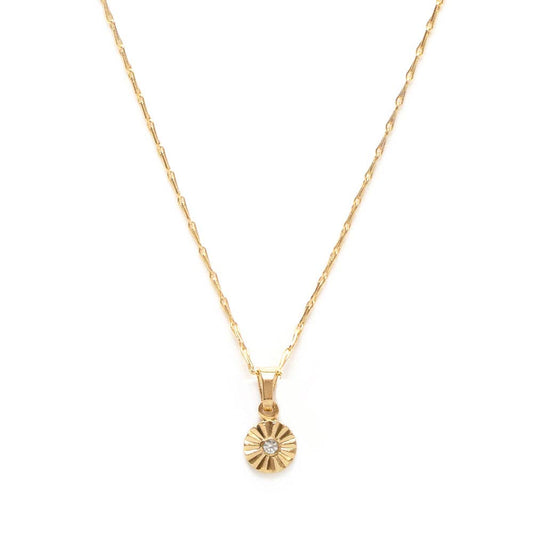 Gold necklace with a sunflower-shaped pendant on a white background